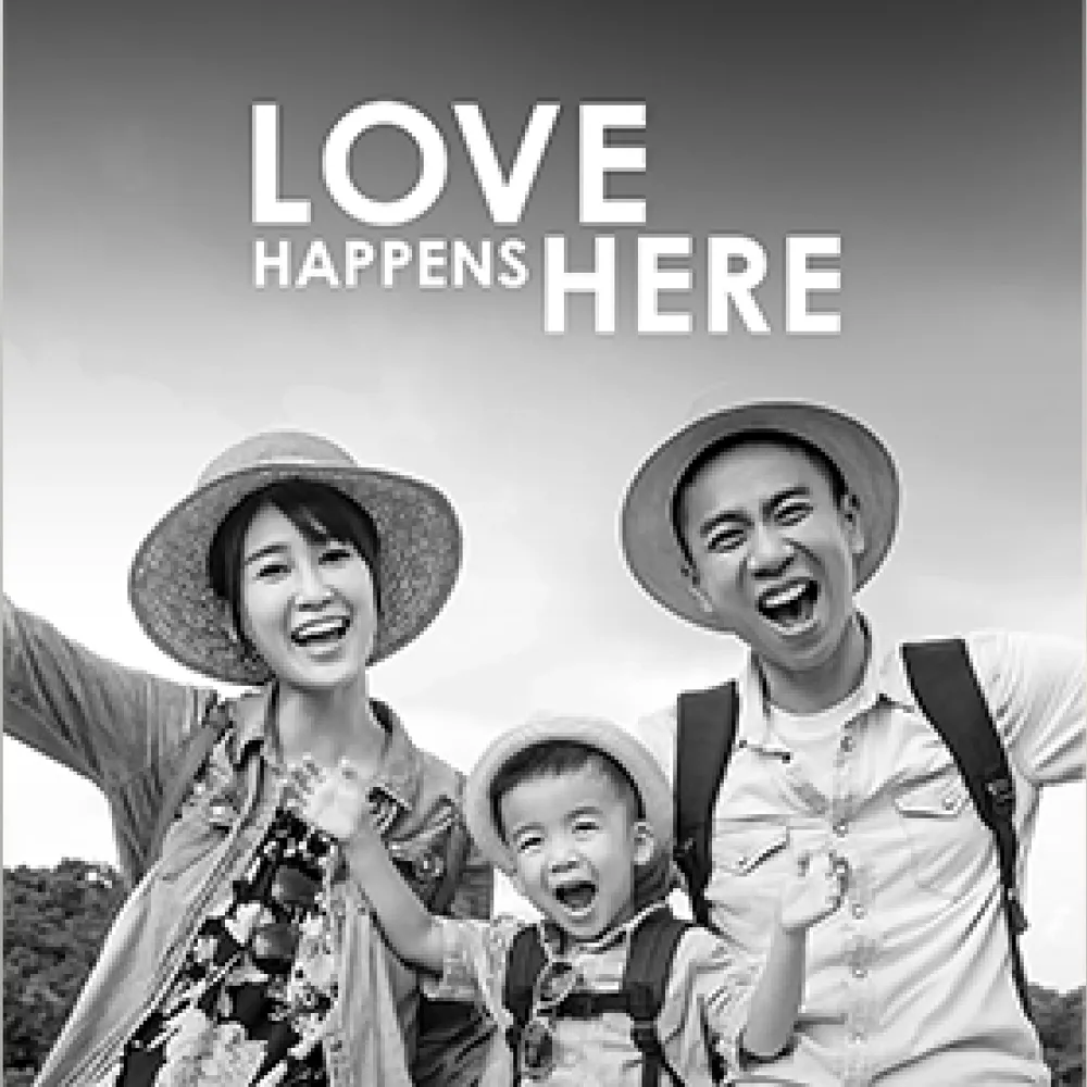 a happy family with the words 'love happens here'